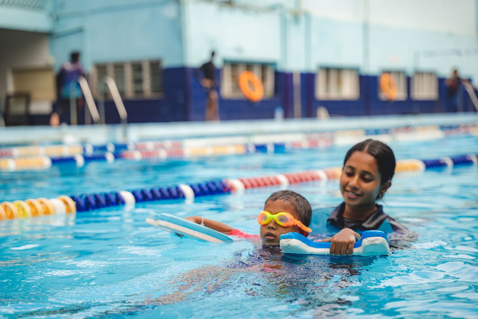 Swimmers and coaches training