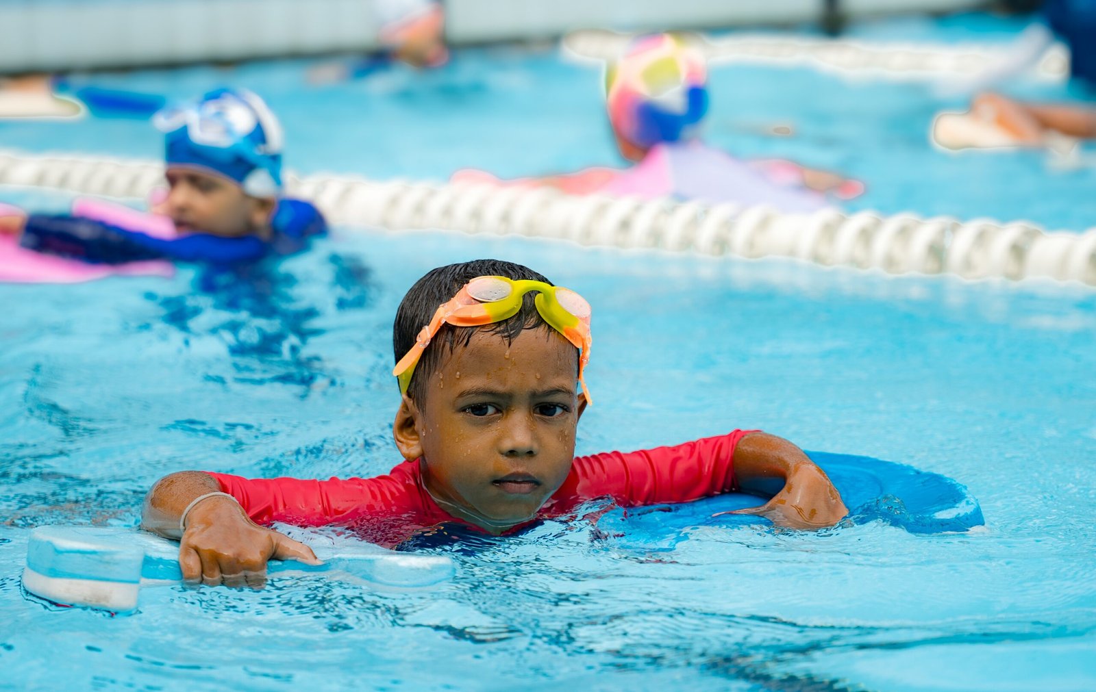 Child swimming underwater at Stingrays