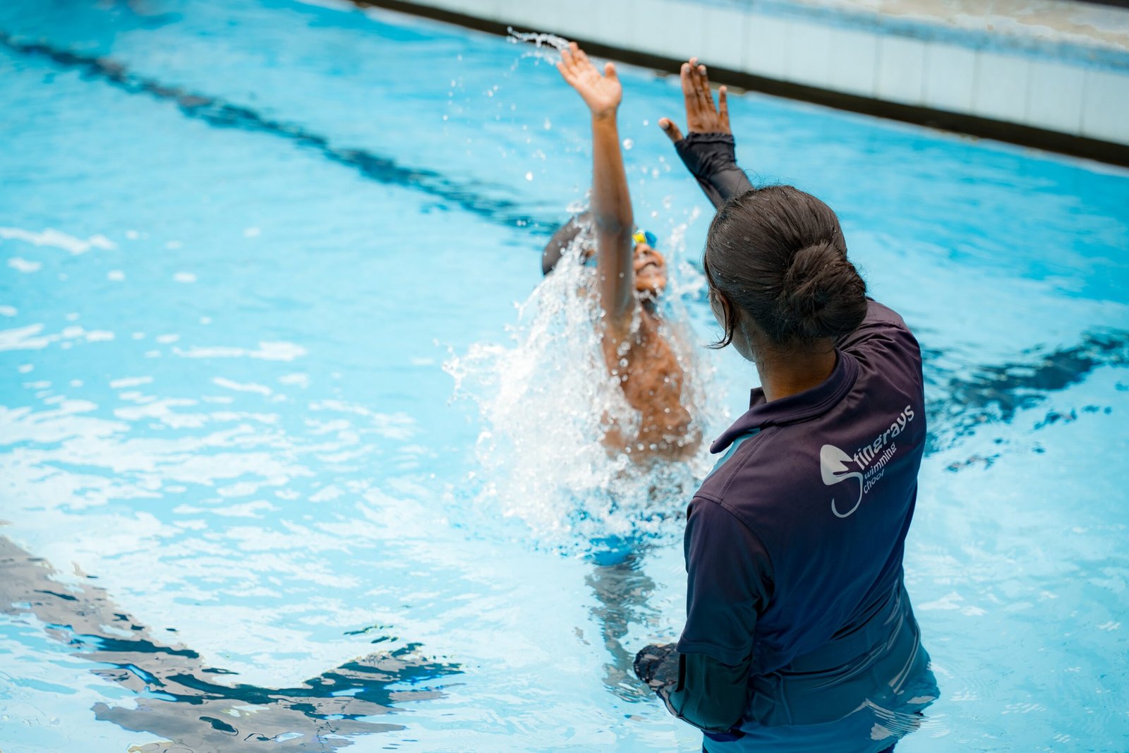 Children and coaches in the pool